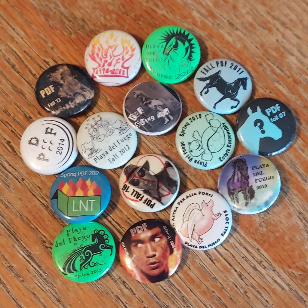 various volunteer swag buttons from prior PDFs